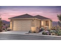 Charming single-story home boasts a desert landscape, two-car garage, and tile roof, perfect for Southwest living at 17628 W San Juan Ave, Litchfield Park, AZ 85340