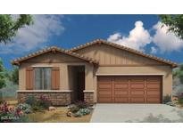 Charming single-story home featuring a neutral color palette, a two-car garage, and a cozy front yard with lush landscaping at 18261 W Soft Wind Dr, Surprise, AZ 85387