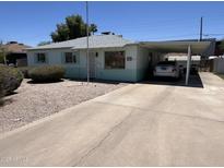 Charming single-story home featuring a carport and low-maintenance landscaping in a quiet neighborhood at 2937 W Marshall Ave, Phoenix, AZ 85017