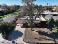 Charming single-story home with a tile roof, mature trees, and a spacious front yard at 3404 N Kachina Ln, Scottsdale, AZ 85251