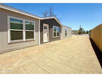 Charming single-story home featuring a well-maintained exterior, gravel landscaping, and inviting front entrance at 46 S 96Th St, Mesa, AZ 85208