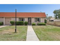 Charming single story home with desert landscaping and walkway to entry door at 5154 N 83Rd St, Scottsdale, AZ 85250