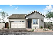 Charming one-story home with a gray exterior, a two-car garage, and well-manicured landscaping at 5901 S Red Rock St, Gilbert, AZ 85298