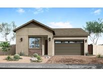 Charming single-story home with a desert landscape, stone accents, and a two-car garage at 5909 S Red Rock St, Gilbert, AZ 85298