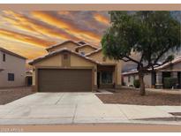Charming single-Gathering home featuring a two-car garage, desert landscaping, and a warm, inviting curb appeal at 6538 W Nez Perce St, Phoenix, AZ 85043