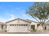 Charming single-story home featuring a neutral color scheme, desert landscaping, and a two-car garage at 8832 W Manzanita Dr, Peoria, AZ 85345