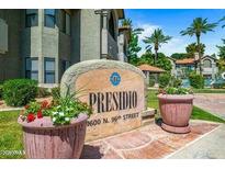 Welcoming community sign with lush landscaping in front of the Presidio residences at 9600 N. 96th Street at 9600 N 96Th St # 263, Scottsdale, AZ 85258