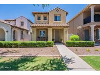 Charming two-story home with a tile roof, covered porch, and well-manicured landscaping at 1086 S Nancy Ln, Gilbert, AZ 85296