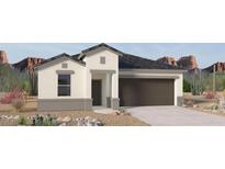 New construction home with a two car garage, stucco, and desert landscaping in front at 1337 W Hess Ave, Coolidge, AZ 85128