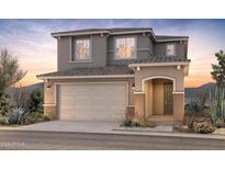 Charming two-story home with a neutral color palette and well-manicured landscaping, presenting an inviting curb appeal at 17608 W San Juan Ave, Litchfield Park, AZ 85340