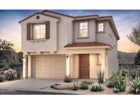 Charming two-story home features a stucco exterior, tile roof, and desert landscaping at 17612 W San Juan Ave, Litchfield Park, AZ 85340