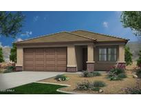Charming single-story home featuring a two-car garage and low-maintenance desert landscaping at 18247 W Soft Wind Dr, Surprise, AZ 85387
