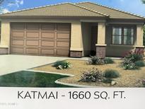 Charming single-story home featuring a neutral color scheme, desert landscaping and a two-car garage at 18247 W Soft Wind Dr, Surprise, AZ 85387