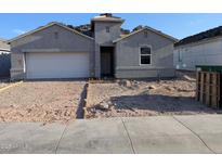 New construction home featuring a two-car garage, neutral colors, and contemporary design elements at 18795 E Bruno Dr, Gold Canyon, AZ 85118