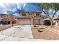 Charming two-story home featuring a well-maintained yard and a spacious two-car garage at 22074 W Papago St, Buckeye, AZ 85326