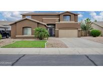 Stunning two-story home with a two-car garage and desert landscaping at 4647 E County Down Dr, Chandler, AZ 85249