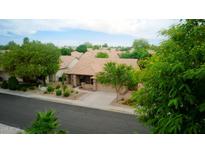 Attractive single story home featuring a desert landscape, tile roof, and covered front porch at 5451 W Folley St, Chandler, AZ 85226