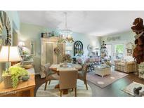 Bright living space with a charming dining area and decor creating a welcoming atmosphere at 930 N Mesa Dr # 1045, Mesa, AZ 85201