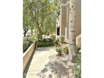 Beautifully landscaped walkway leads to the building entrance, enhancing curb appeal at 9600 N 96Th St # 267, Scottsdale, AZ 85259
