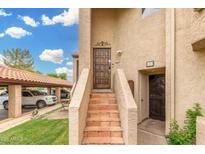 Charming front entrance featuring a private doorway, complemented by well-maintained steps at 10301 N 70Th St # 223, Paradise Valley, AZ 85253