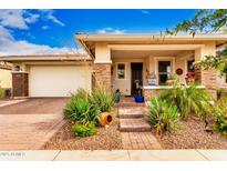 Charming single-story home featuring a welcoming front porch and well-maintained landscaping at 10545 E Texas Ave, Mesa, AZ 85212