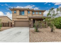 Charming two-story home with a two car garage and low maintenance desert landscaping at 21610 N Bradford Dr, Maricopa, AZ 85138