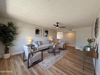 Inviting living room featuring neutral tones, modern furnishings, and stylish decor for a comfortable living space at 2337 E Manhatton Dr, Tempe, AZ 85282