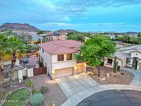 Beautiful two-story home with a three-car garage and landscaped yard in a serene community with mountain views at 27803 N 59Th Dr, Phoenix, AZ 85083