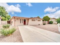 Charming single-story home with desert landscaping and a long driveway at 3124 W Port Royale Ln, Phoenix, AZ 85053