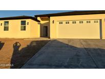 Charming single-story home with neutral stucco, a 2-car garage, and a concrete driveway at 3627 W Palmaire Ave, Phoenix, AZ 85051