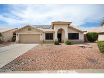 Charming single-story home featuring a well-maintained front yard, neutral color palette, and a two-car garage at 6366 W Saint John Ave, Glendale, AZ 85308