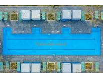 Stunning aerial view of a large community pool with cabanas and lounge chairs, perfect for relaxation and enjoyment at 7120 E Kierland Blvd # 811, Scottsdale, AZ 85254