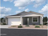 Charming single-story home with a two-car garage and desert landscaping at 7709 W Saddlehorn Rd, Peoria, AZ 85383