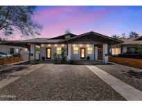 Charming duplex with individual entrances, desert landscaping, and a shared driveway at 1306 E Fillmore St, Phoenix, AZ 85006