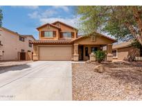 Inviting two-story home with a neutral palette, desert landscaping, covered porch, and a two-car garage at 136 W Brahman Blvd, San Tan Valley, AZ 85143