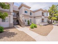 Exterior of condo building with multiple levels, stairwell and desert landscaping at 1941 S Pierpont Dr # 2073, Mesa, AZ 85206