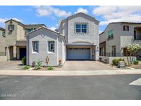 Charming two-story home features a neutral color scheme, attached garage, and well-maintained landscaping at 226 E Markwood Dr, Chandler, AZ 85286