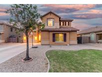 Charming home featuring a spacious front yard and a well-maintained exterior with a basketball hoop at 2986 E Country Shadows St, Gilbert, AZ 85298
