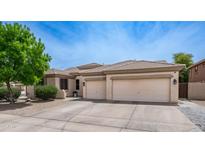 Charming single-story home features a spacious driveway and well-manicured landscaping at 3103 S Benton --, Mesa, AZ 85212