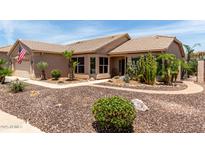 Charming single-story home featuring desert landscaping with an American flag waving in the front at 3930 E Colonial Dr, Chandler, AZ 85249