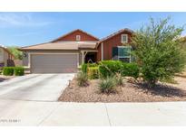 Charming single-story home with a well-maintained front yard and attached two-car garage at 652 E Rojo Way, Gilbert, AZ 85297