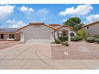 Charming single-story home with a well-manicured front yard and attached two-car garage at 732 W Sagebrush St, Gilbert, AZ 85233