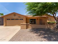 Charming single-story home with a two-car garage, desert landscaping, and inviting curb appeal at 922 S 80Th St, Mesa, AZ 85208