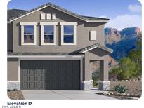 Charming two-story home with a grey exterior, attached garage, and well-manicured landscaping at 9819 S 11Th St, Phoenix, AZ 85042