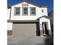 Charming two-story home featuring a two-car garage and stone accents at 9819 S 11Th St, Phoenix, AZ 85042
