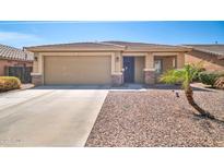 Charming single-story home featuring a two-car garage, low-maintenance landscaping, and a neutral color palette at 16887 W Belleview St, Goodyear, AZ 85338