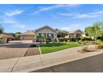 Charming home featuring manicured landscaping and a well-maintained lawn at 2094 E Aris Dr, Gilbert, AZ 85298