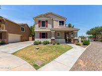 Charming two-story home featuring red shutters and a cozy front porch at 2150 E Sunland Ave, Phoenix, AZ 85040