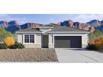 Charming single-story home featuring a two-car garage, neutral color palette and manicured landscaping at 24052 W Pima St, Buckeye, AZ 85326