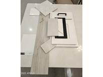 Selection of tile, flooring and cabinet samples with modern finishes and textures at 2508 E Preston St, Mesa, AZ 85213